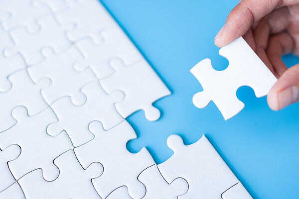 Puzzle piece is inserted into puzzle
